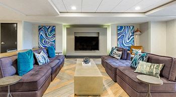 a living room with couches and a television